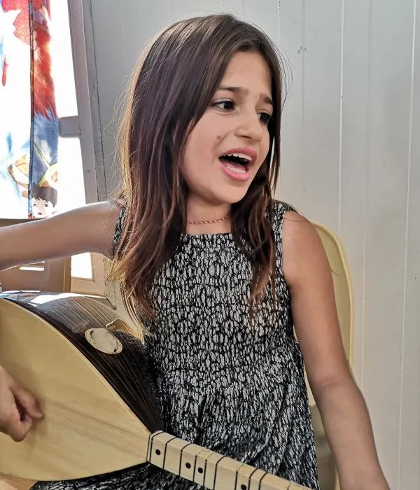 A young student on the music programme