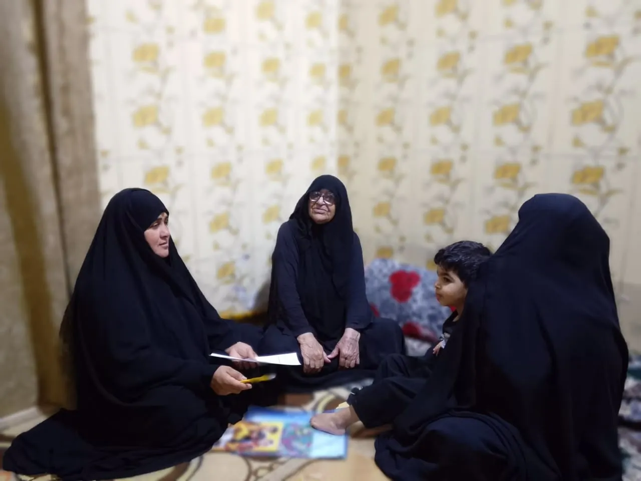 A Women Health Volunteer on a family visit, Al Khora