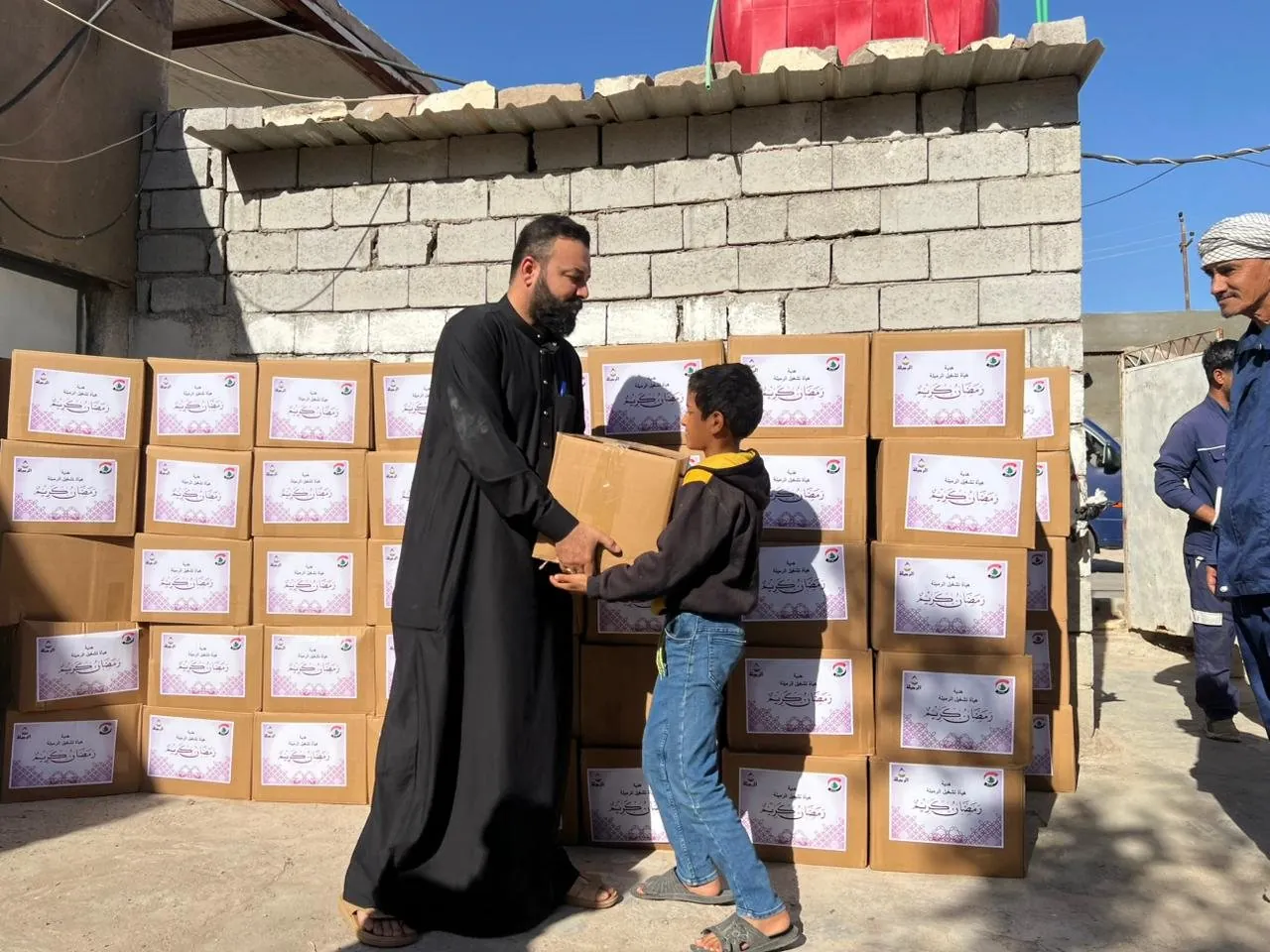 A family receives their Ramadan box