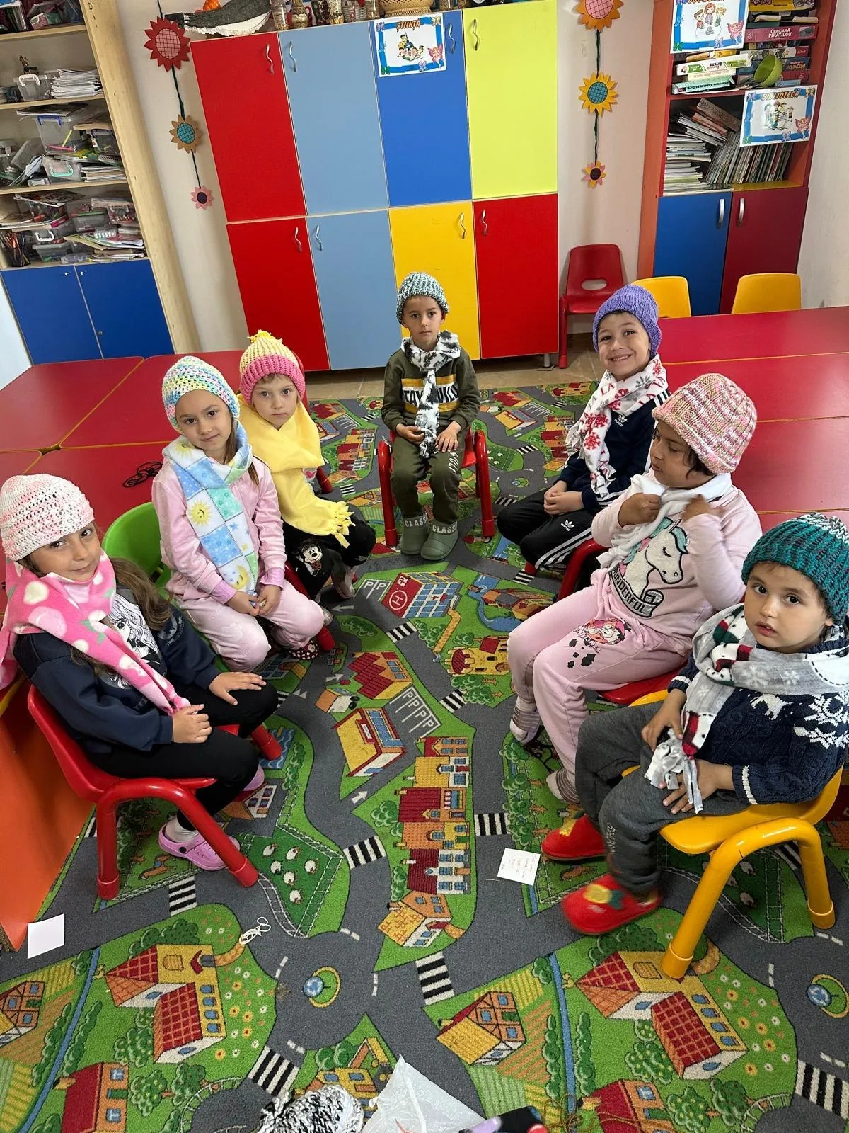 Kindergarten children in their new hats and scarves