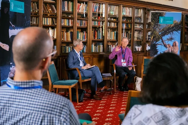 The two conference chairs in conversation in the library at St George's House